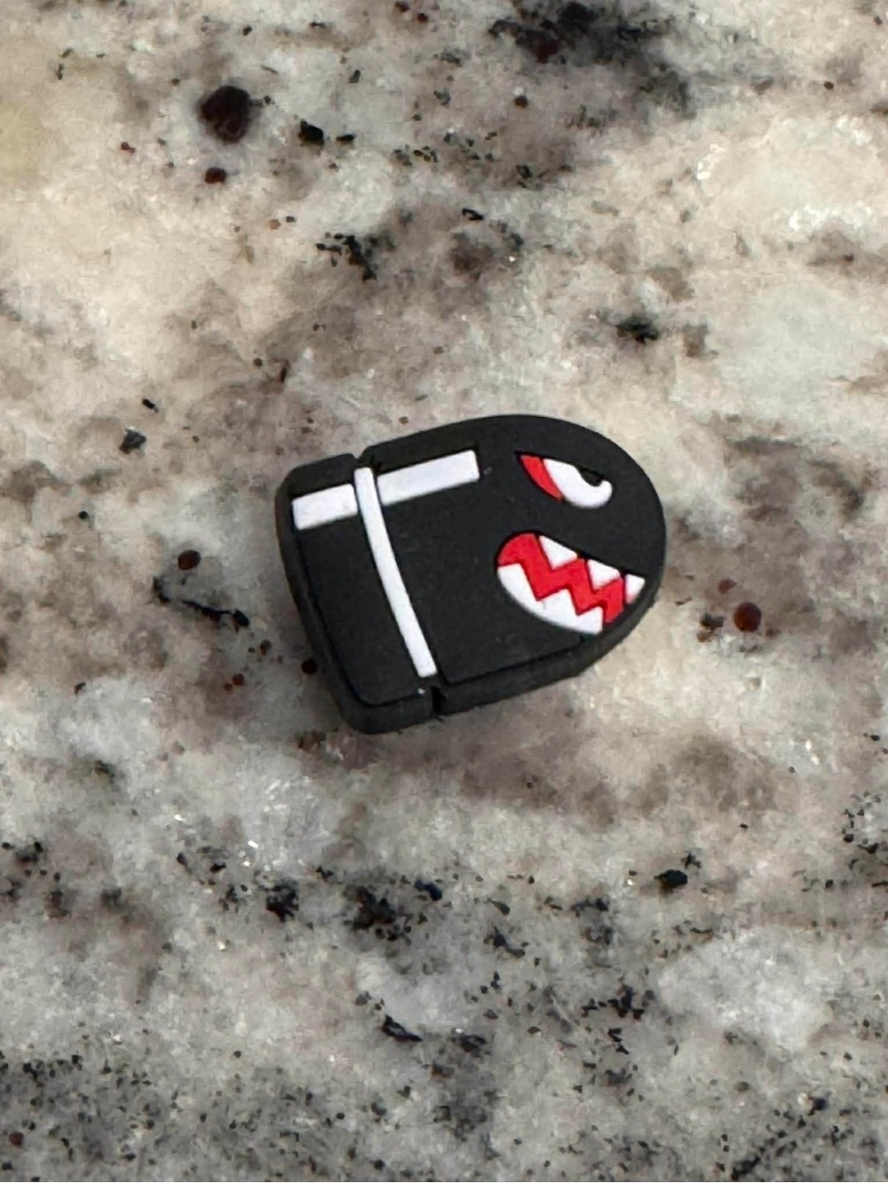 CROCS Black and White Bullet Character Jibbitz Charm with Red Accents